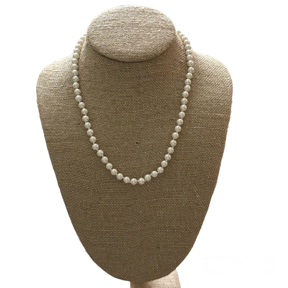 Vintage Talbots string of white pearls with gold toned box clasp.